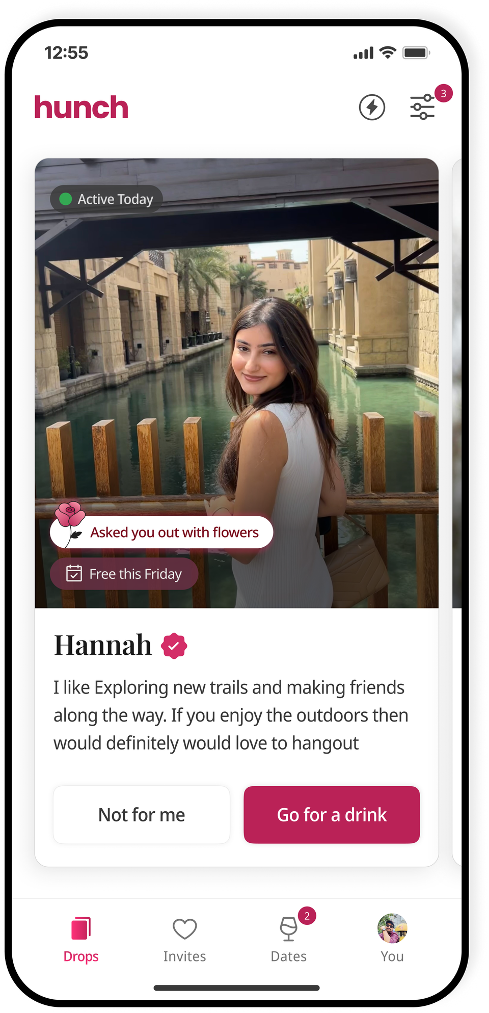 A profile in a Hunch daily drop — Hannah, photo-verified, with an 'Asked you out with flowers' invite, a 'Free this Friday' badge, and a 'Go for a drink' button.