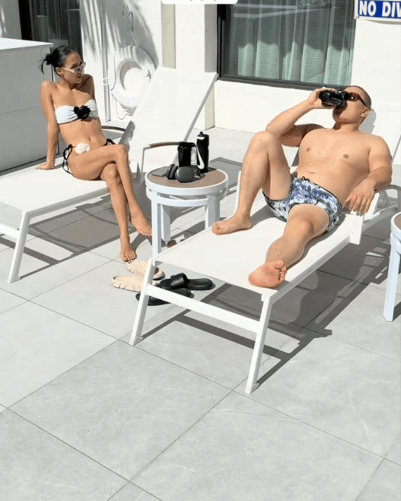 Jake and Emma, a Hunch couple, relaxing poolside.