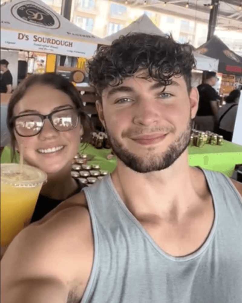 Nate and Jess, a Hunch couple, at an outdoor food market.